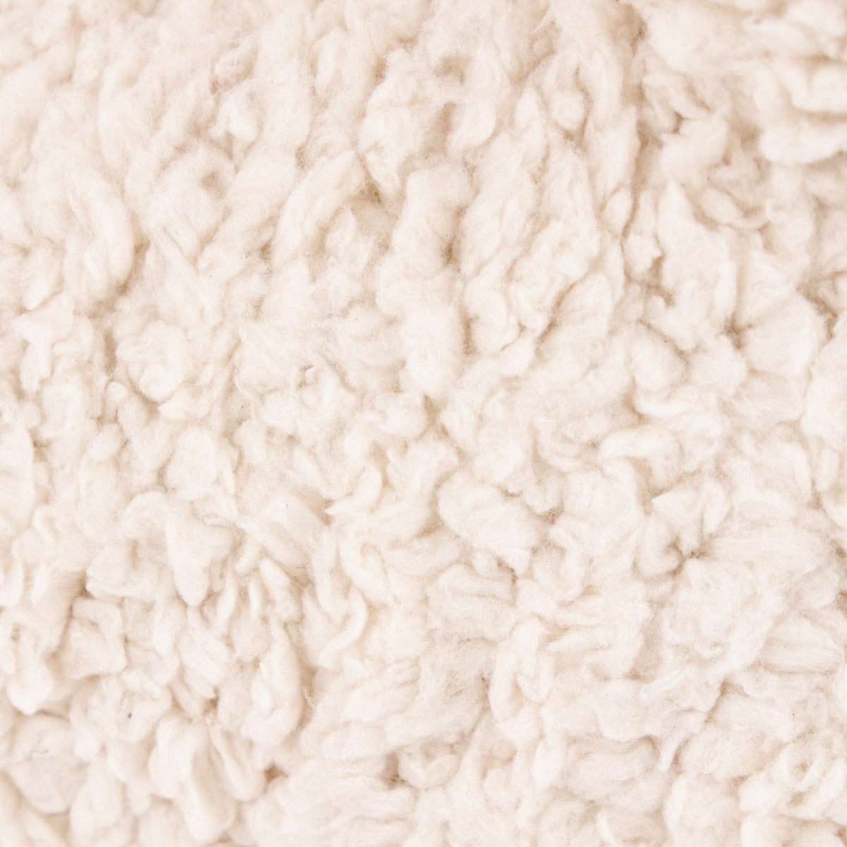 Close-up of the curly sherpa pile texture on the Sheep Wool Cotton Door Stop in white, showing the soft, looped shearling-look body fabric.