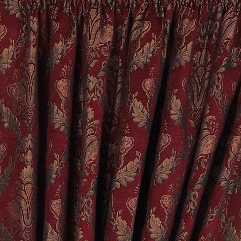 Close-up of Shiraz Jacquard Chenille pencil pleat curtains in burgundy, showing a woven gold and green floral damask pattern with pencil pleat heading tape.