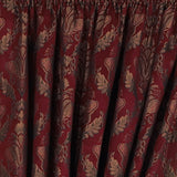 Close-up of Shiraz Jacquard Chenille pencil pleat curtains in burgundy, showing a woven gold and green floral damask pattern with pencil pleat heading tape.