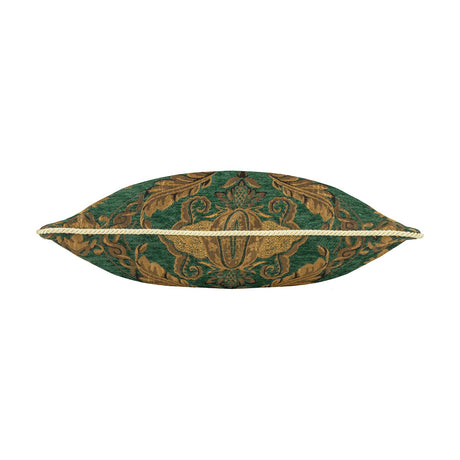 Shiraz Jacquard Chenille Cushion in Emerald, shown end-on to reveal a plump silhouette with a gold cord-piped seam, woven with a green and gold floral damask pattern on a plain white background.