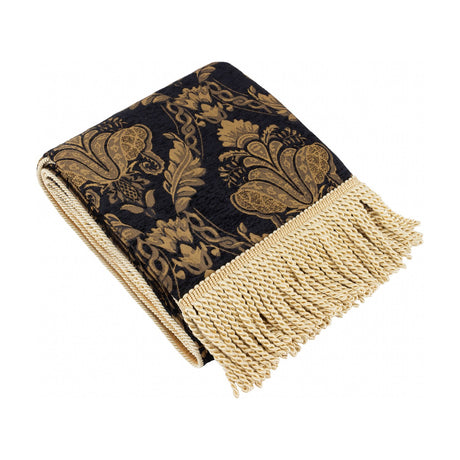 Shiraz Jacquard Chenille Throw in black, folded with woven gold floral damask pattern and long cream bullion fringe on one end, shown on a white background.