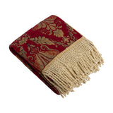 Shiraz Jacquard Chenille Throw in burgundy, folded to show a gold floral damask pattern and twisted gold fringe trim, on a plain white background.