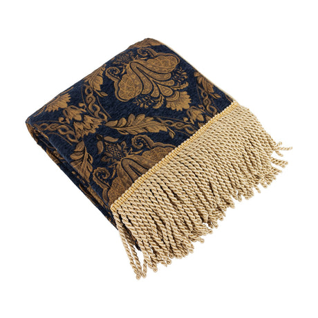 Shiraz Polyester Throw in navy, folded to show a gold damask jacquard pattern and a long knotted fringe edge, on a plain white background.