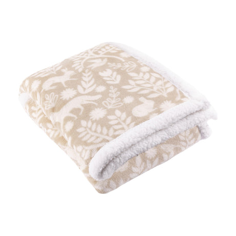 Skandi Woodland Printed Polyester Throw in Sable, folded to show a cream woodland pattern of deer, foxes and foliage with white sherpa fleece trim, on a white background.