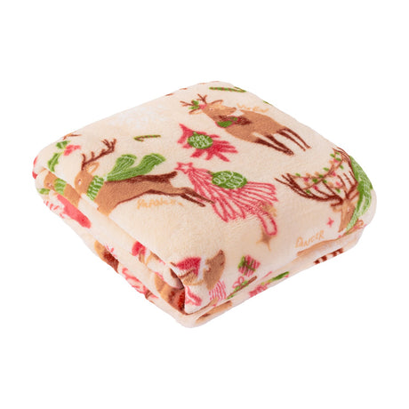 Folded polyester fleece throw in cream with a printed reindeer and Christmas tree design in pink, red, green and brown, shown on a white background.