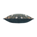 Side view of the Snakes Head Jacquard Chenille Cushion, showing the plain indigo velvet back panel and the edge of the jacquard floral front in leaf green, cream and tan, on a white background.