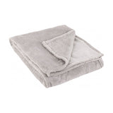 Folded grey faux fur throw with embossed snowflake pattern, showing plain reverse side, on a white background.