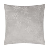 Square grey faux fur cushion with raised tonal snowflake and star motifs textured into the pile, shown on a plain white background.