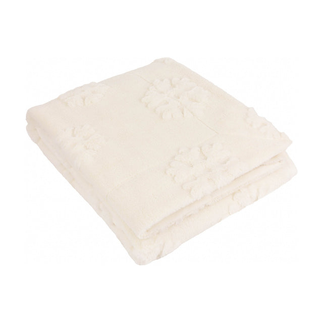 Folded snow white faux fur throw with raised snowflake pattern on a long-piled velvet surface, shown on a plain white background.