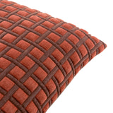 Close-up of the Softie Check polyester cushion in cinnamon orange, showing a raised quilted grid texture with chocolate brown recessed channels, on a plain white background.