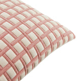 Close-up of the Softie Check Polyester Cushion in pink, showing a raised grid of pink cording over cream panels, photographed against a plain white background.