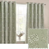 Sophia Jacquard Embroidered Eyelet Curtains in sage green with floral pattern, hung on a metal pole beside a window, with a fabric swatch detail showing the woven botanical design.