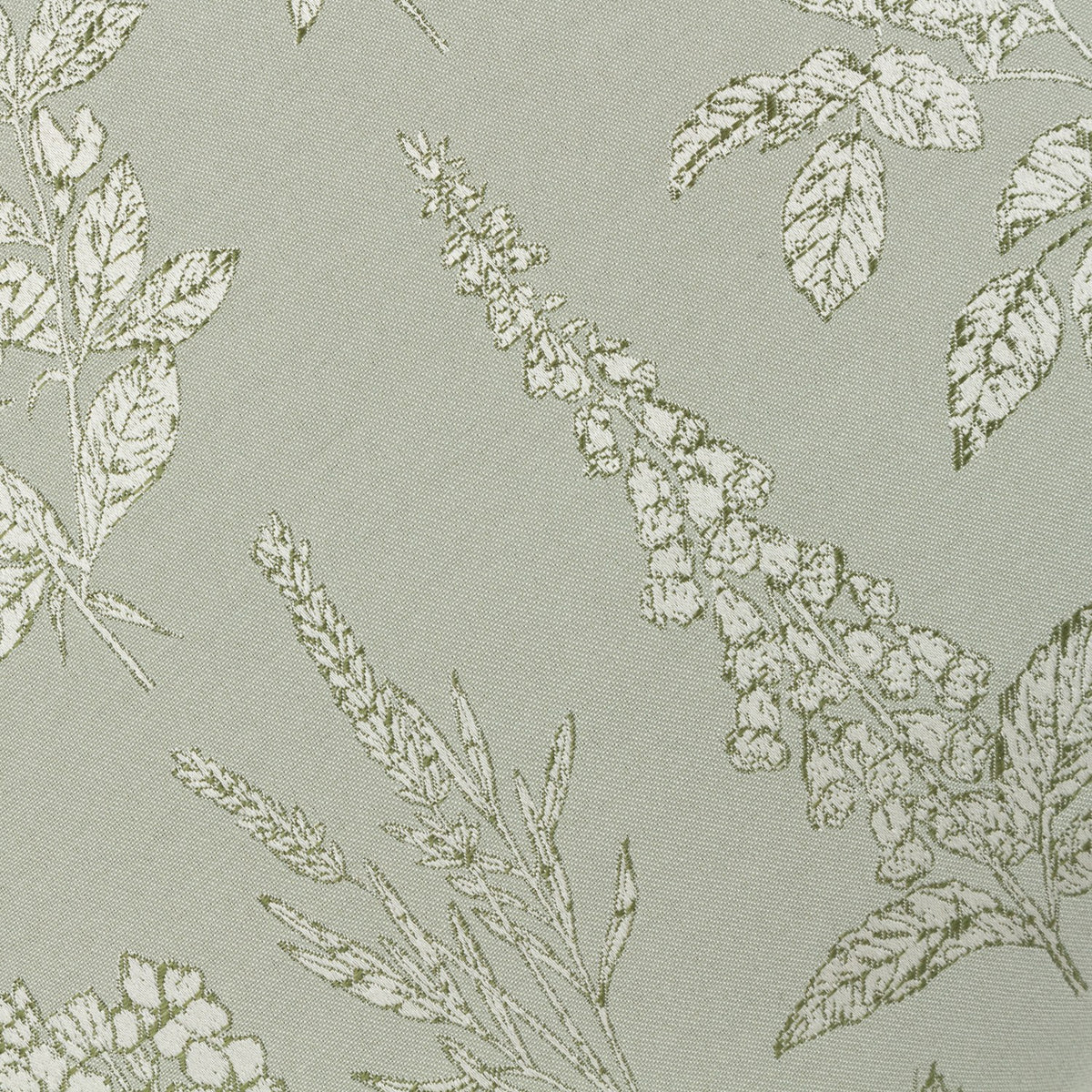 Close-up of the Sophia Eyelet Polyester Cushion in Sage, showing a jacquard-woven botanical pattern of foxgloves, roses and leaves in cream and olive on a sage fabric ground.