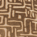 Soren Abstract Velvet Cushion in brown, close-up of the cut velvet pile showing a raised geometric maze pattern shifting from deep brown to soft gold.