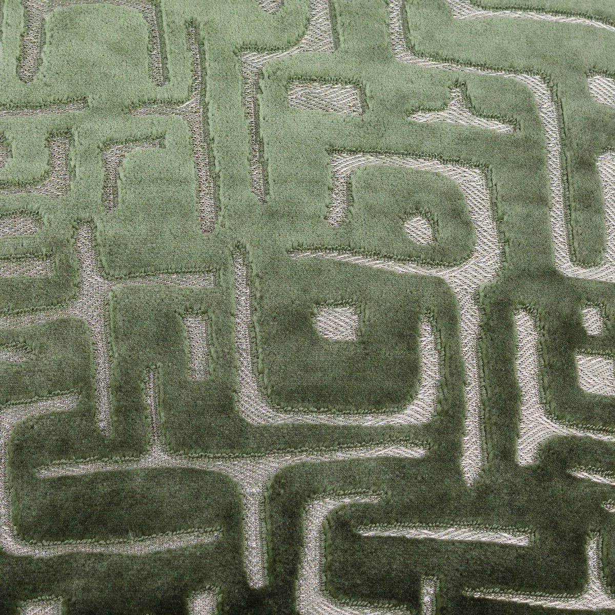 Soren Abstract Velvet Cushion in Smoke Green, close-up of cut velvet fabric with a maze-like geometric pattern in raised and flat pile textures.