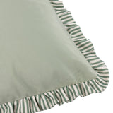 Close-up of the Solene Ruffle Velvet Linen Cushion in sage, showing the matt velvet face bordered by a green and white striped linen ruffle trim on a white background.