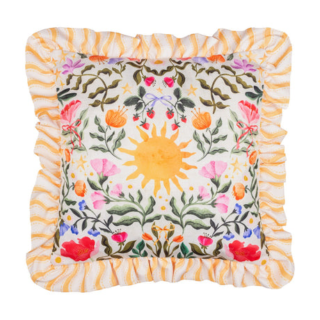 Summer Solstice square cushion with ruffled yellow wave-stripe trim, cream front printed with a central sun, foliage, poppies, strawberries and coloured bows, on a white background.