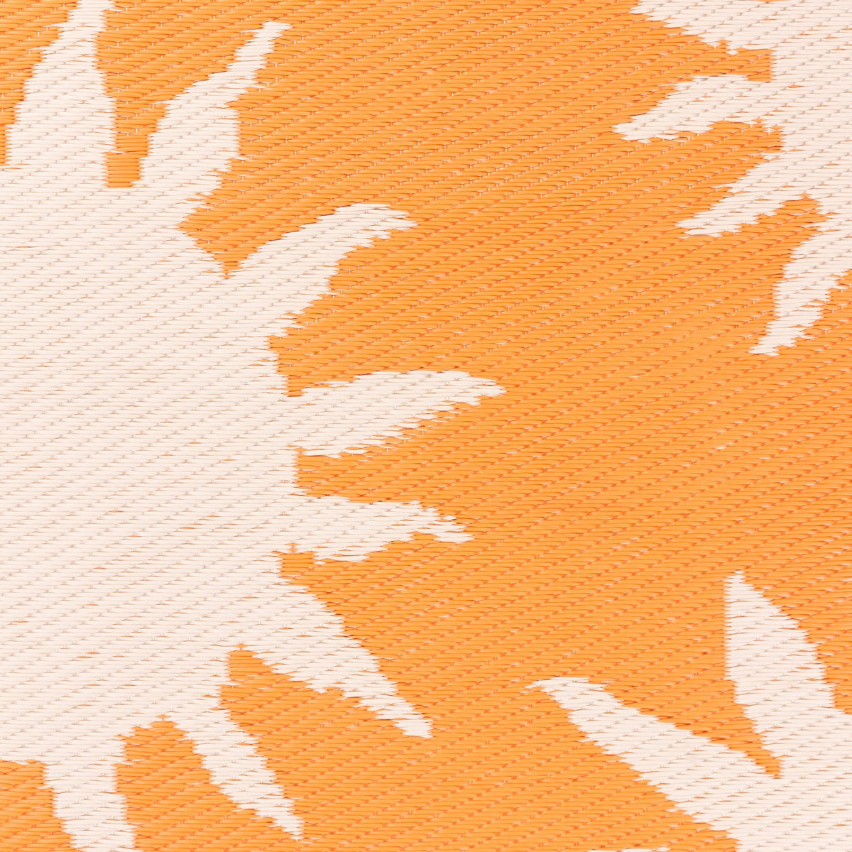 Close-up of the Summer Solstice Reversible Abstract Rug in Sunrise Yellow, showing a woven sun-ray pattern in cream against a warm orange background.