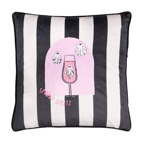 Spooky Spritz Striped Velvet Cushion in pink and mono, featuring black and white stripes, a pink arch with a ghost in a cocktail glass, and embroidered text, on a plain background.