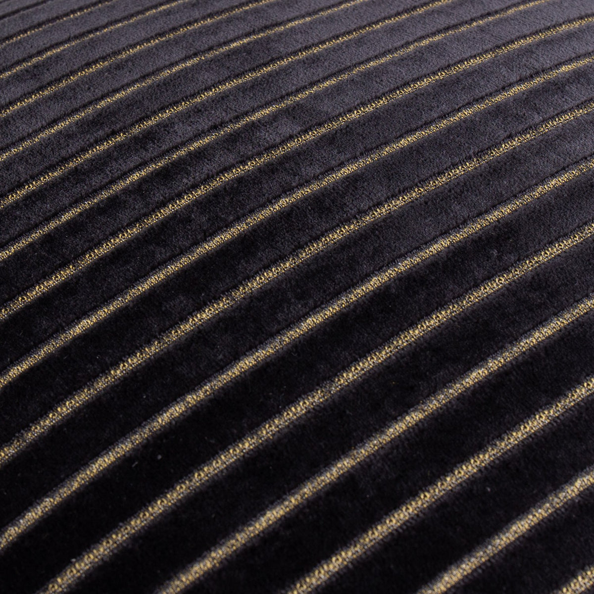 Close-up of the Savoy Stripe Polyester Velvet Cushion in black, showing diagonal ribbed velvet stripes with fine gold thread detailing.