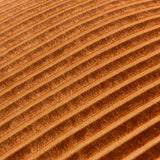 Close-up of the Savoy Stripe cushion's ridged velvet front, showing diagonal corded stripes in warm brick orange with light-catching texture.