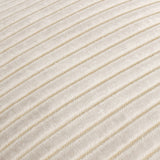 Close-up of the Savoy Stripe cushion in oyster cream, showing raised cut-velvet ribs with a subtle gold shimmer between finer channels.
