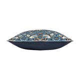 Side view of the Strawberry Thief Floral Polyester Cushion in indigo, showing the William Morris bird and strawberry print with pale piping against a plain solid indigo reverse, on a white background.