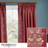 Berry red velvet pencil pleat curtains with Strawberry Thief embroidered leading edge, shown pleated on a wooden pole beside a window, with fabric swatch detail inset.