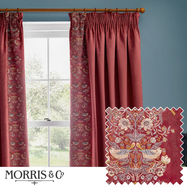 Berry red velvet pencil pleat curtains with Strawberry Thief embroidered leading edge, shown pleated on a wooden pole beside a window, with fabric swatch detail inset.