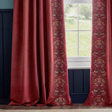Berry red velvet pencil pleat curtains with Strawberry Thief embroidered leading edge in birds and foliage, shown framing a window in a room with navy panelling.