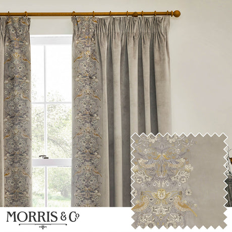 Pencil pleat curtains in biscuit velvet with embroidered Strawberry Thief bird and floral leading edge, shown pleated on a wooden pole beside a window, with fabric swatch inset.