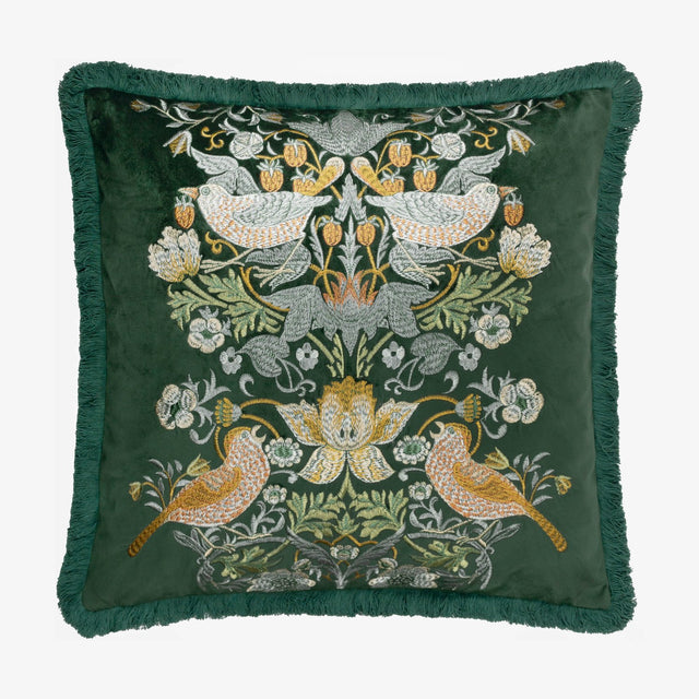 Square forest green velvet cushion with embroidered Strawberry Thief bird and floral design in cream, gold and rust, finished with matching fringe trim.
