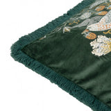 Corner detail of the Strawberry Thief jacquard velvet cushion in forest green, showing embroidered bird and floral design with matching tonal fringe trim.