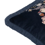 Corner detail of the Strawberry Thief Jacquard Velvet Cushion in indigo, showing plain velvet reverse, embroidered bird and floral motifs on the front, and matching fringed edging.