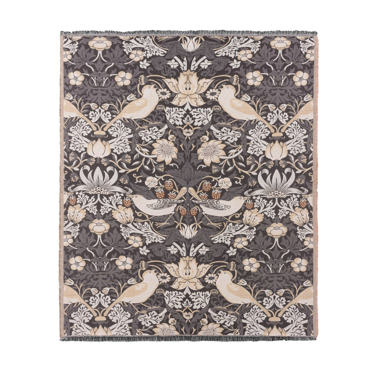 Strawberry Thief Jacquard Cotton Throw in Biscuit, showing birds, flowers and strawberries woven in cream and beige on a charcoal ground with fringed edges, on a plain white background.