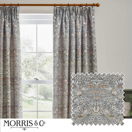 Pencil pleat curtains in Strawberry Thief jacquard pattern, grey and biscuit tones with bird and floral motifs, shown pleated on a wooden pole beside a window, with fabric swatch detail inset.