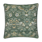 Square jacquard velvet cushion in forest green featuring Morris & Co.'s Strawberry Thief design with woven birds, flowers and foliage, edged with matching piping on a plain white background.