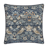 Strawberry Thief Jacquard Velvet Cushion in indigo, square with navy piping, showing birds, strawberries and scrolling foliage woven in blue, grey and gold tones on a plain background.