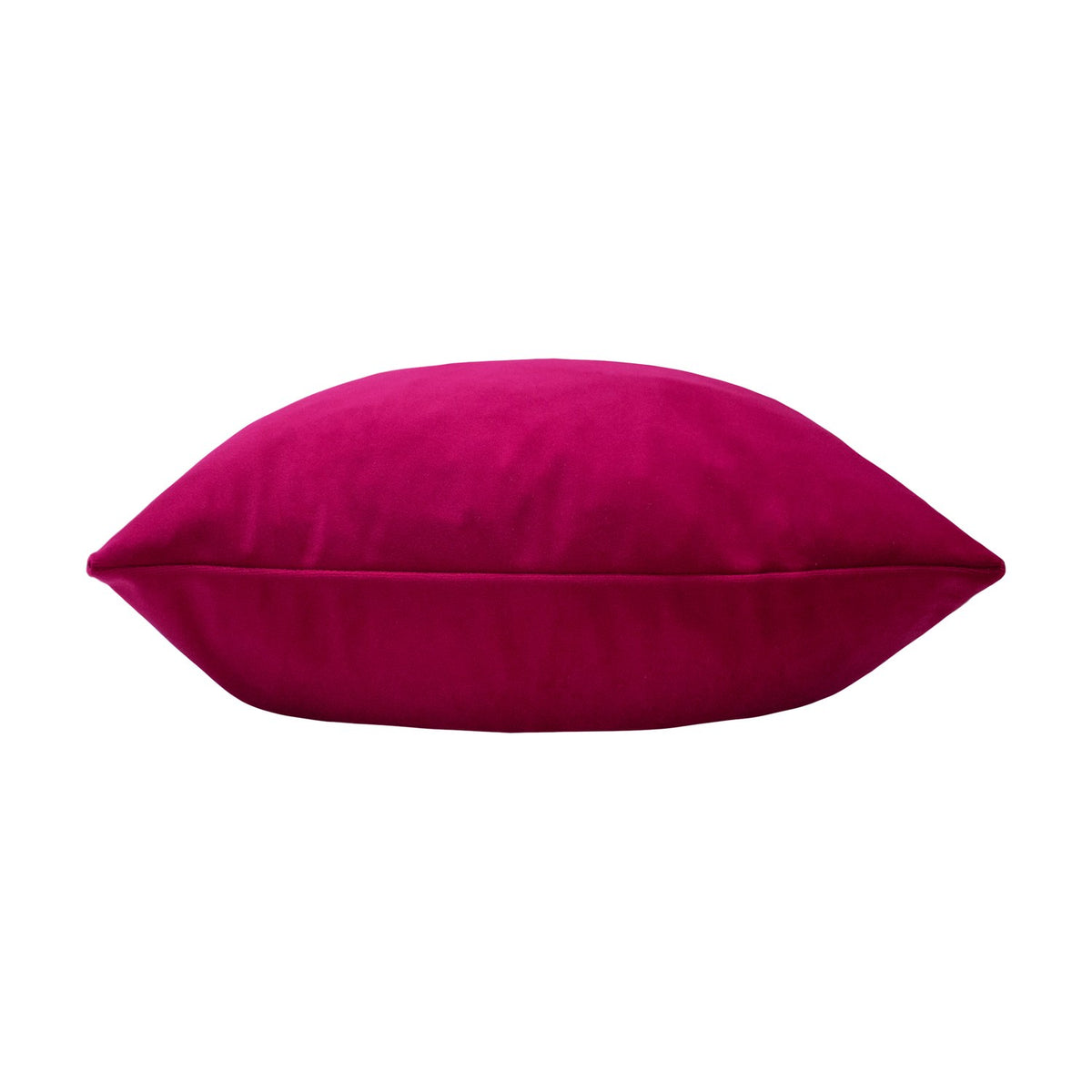 Sunningdale plain velvet cushion in deep cerise pink, shown side-on with piped edges on a plain white background.