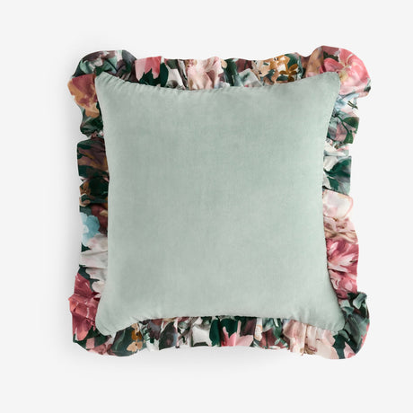 Tahiti Velvet Cotton Cushion in Duck Egg with a plain green velvet face and a printed floral frill trim on all sides, shown on a plain white background.