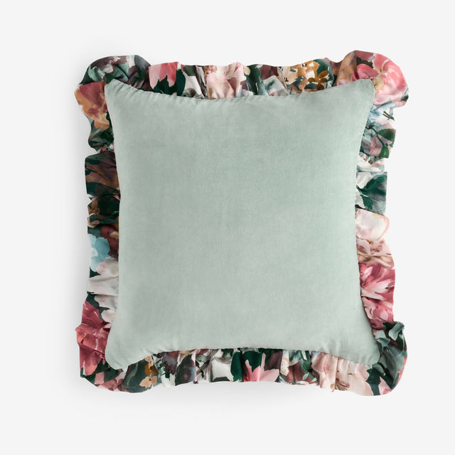 Tahiti Velvet Cotton Cushion in Duck Egg with a plain green velvet face and a printed floral frill trim on all sides, shown on a plain white background.