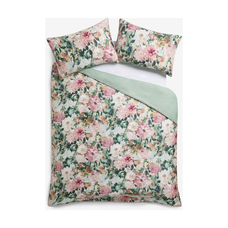 Tahiti Cotton Floral Duvet Cover Set in Spring, showing pink and cream watercolour blooms with green foliage on the front and plain sage green reverse, with matching pillowcases on a white background.