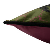Corner detail of the Tropica Cheetah Animal Velvet Cushion in khaki, showing the printed green front with pink foliage outline, black piping, and plain deep red velvet reverse.