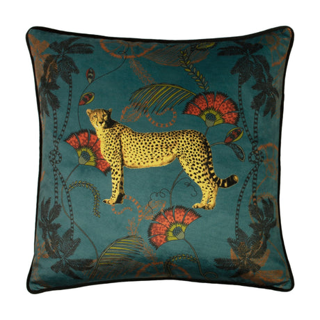 Tropica Cheetah Animal Velvet Cushion in teal, square 45x45cm, printed with a striding cheetah, palms and coral-red flowers, finished with black piping, on a white background.
