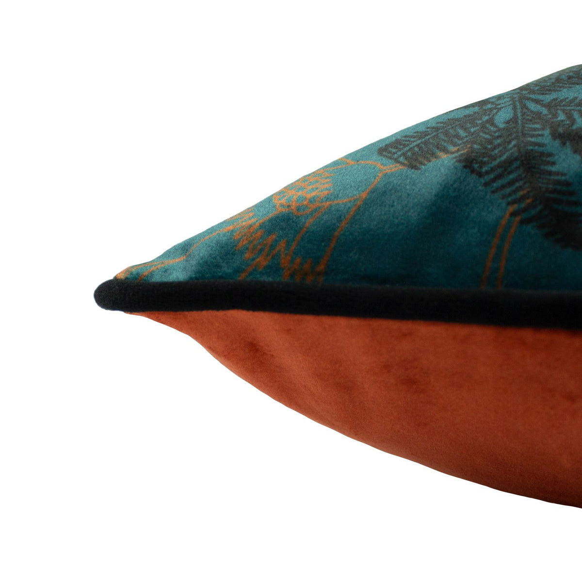 Close-up of the Tropica Cheetah Animal Velvet Cushion in teal, showing printed velvet fabric with black piping edging and a plain rust-orange reverse, on a white background.
