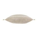 Tide Striped Cotton Cushion in natural sandy beige with fine white stripes, shown lengthways with tasselled corners on a plain white background.