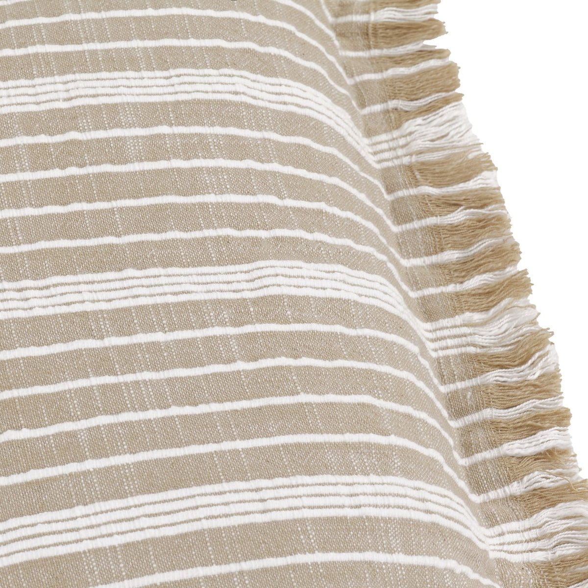 Close-up of the Tide Striped Cotton Cushion in natural beige with fine woven white stripes and a fringed edge along one side.