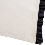 Tilly plain velvet cushion in lace-cream with a black ruffled frill edge, close-up view showing the soft velvet texture and contrast trim.