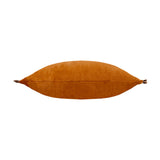 Tilly Reversible Velvet Cushion in rust orange, long rectangular bolster shape with frilled side edges, shown side-on against a plain white background.