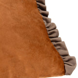 Close-up of the Tilly reversible velvet cushion showing rust-brown velvet fabric with a frilled smoke-grey edge trim along the seam.